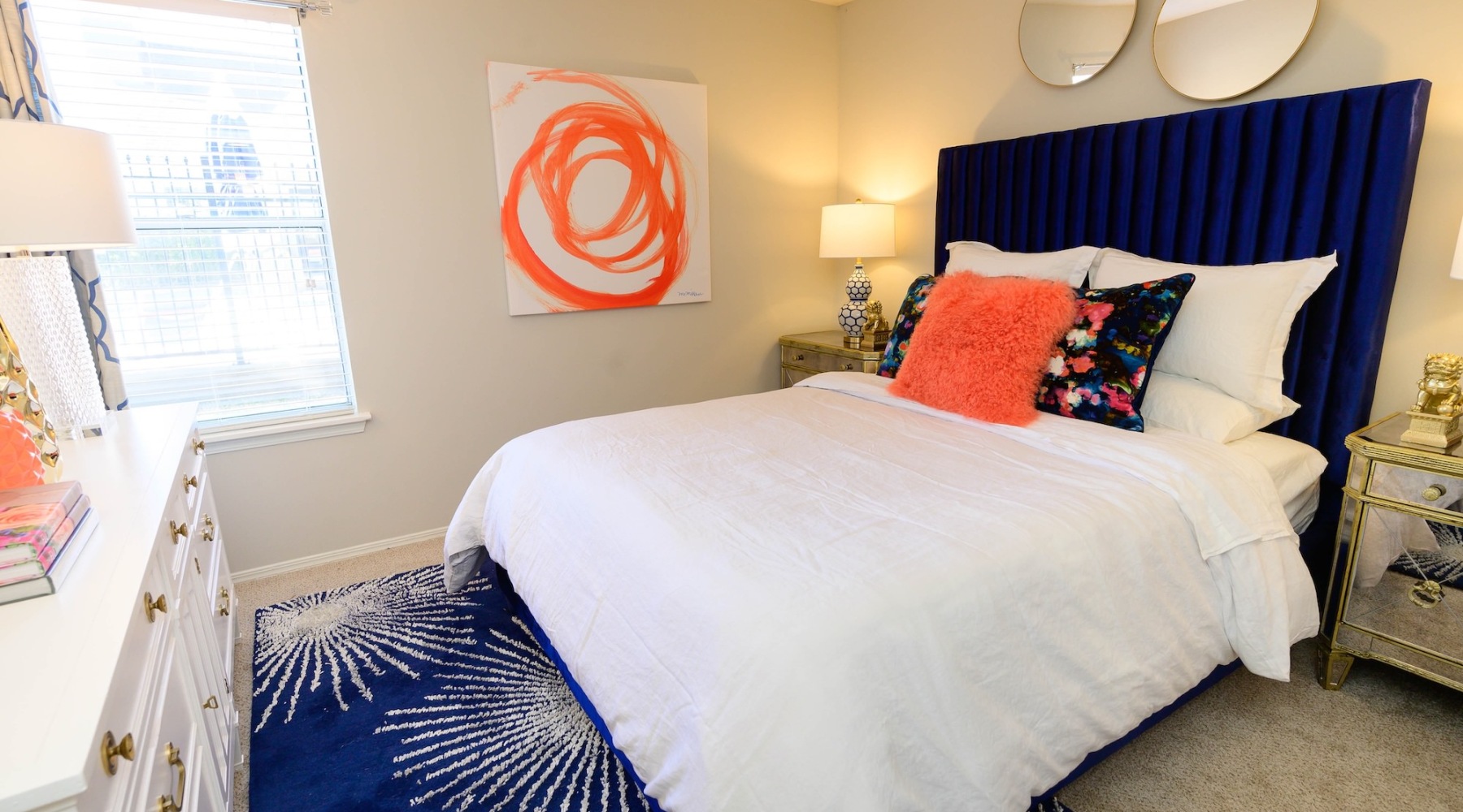 a bedroom with a bed and lamps