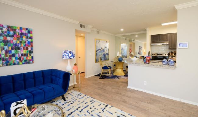 a living room with a blue couch