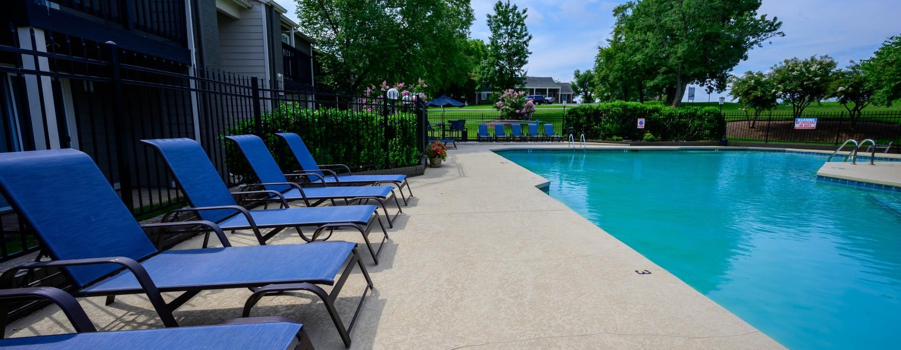 a pool with chairs around it