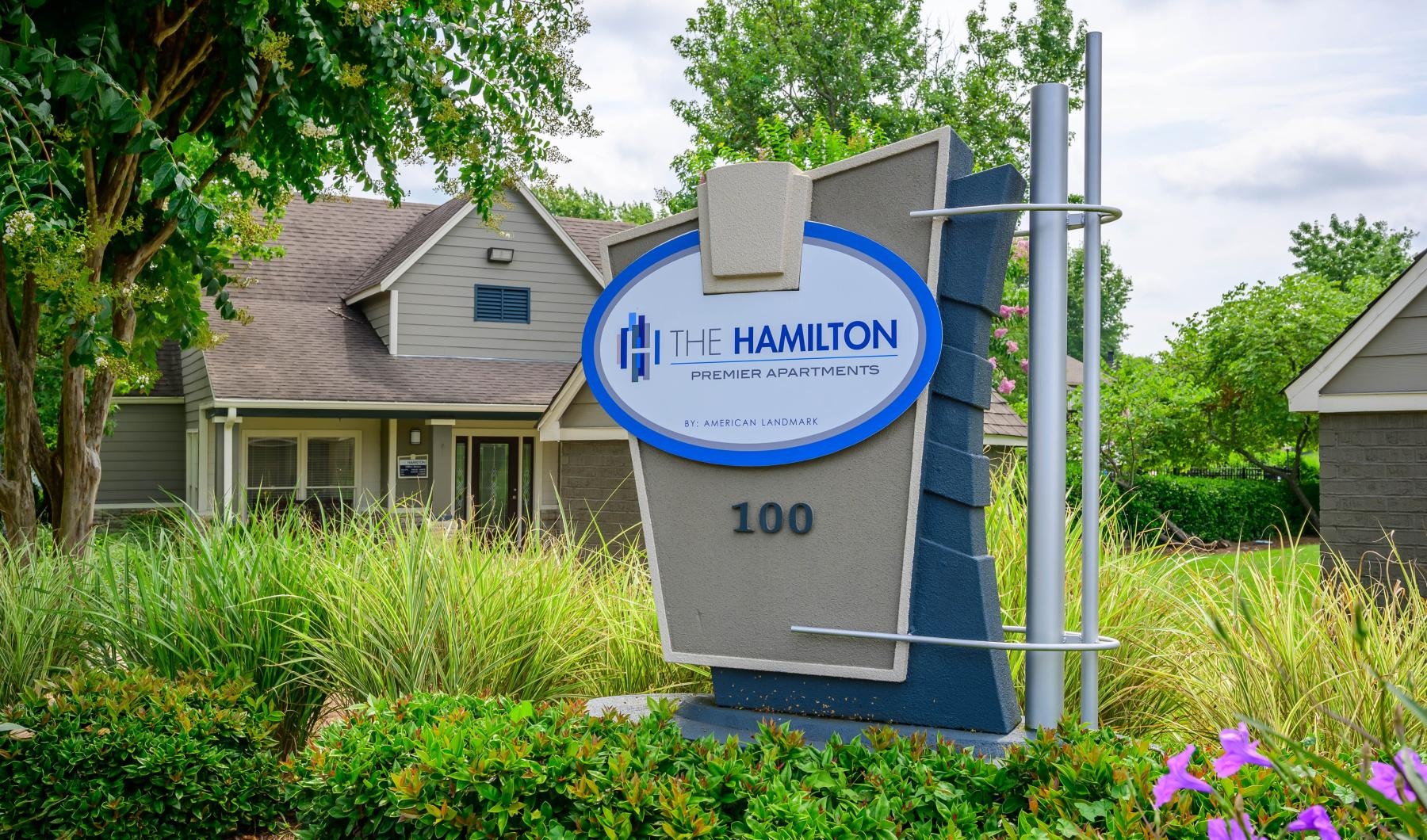 a sign in front of a house