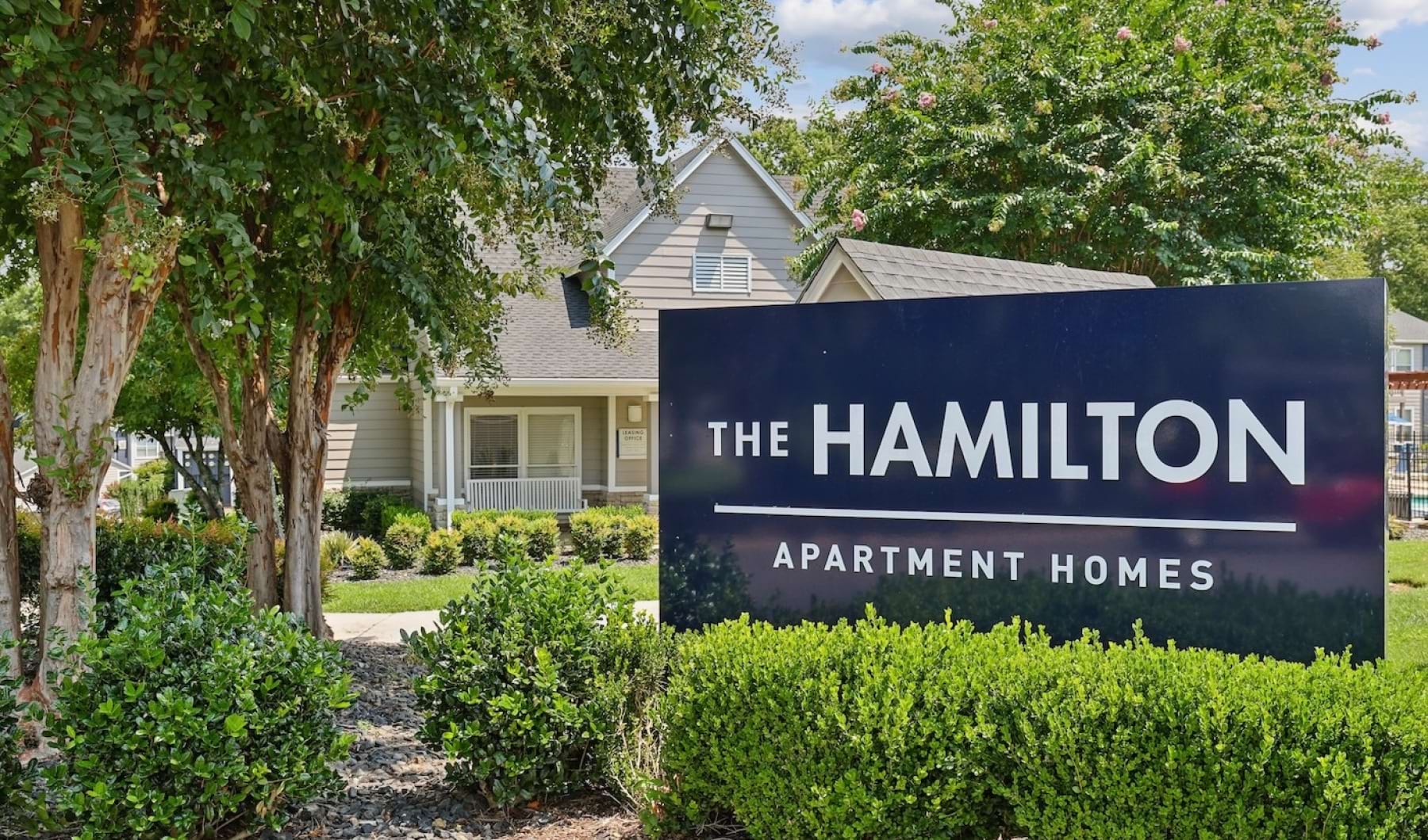 sign in front of a leasing office