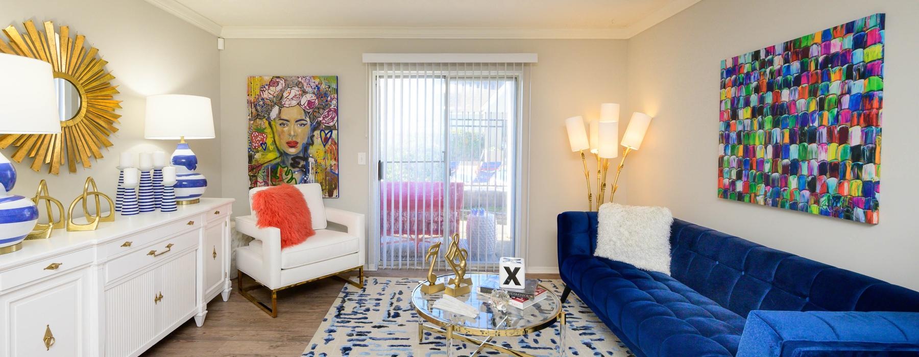 a living room with a blue couch