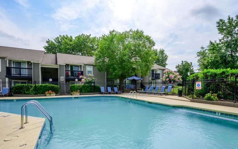 a swimming pool in front of a house