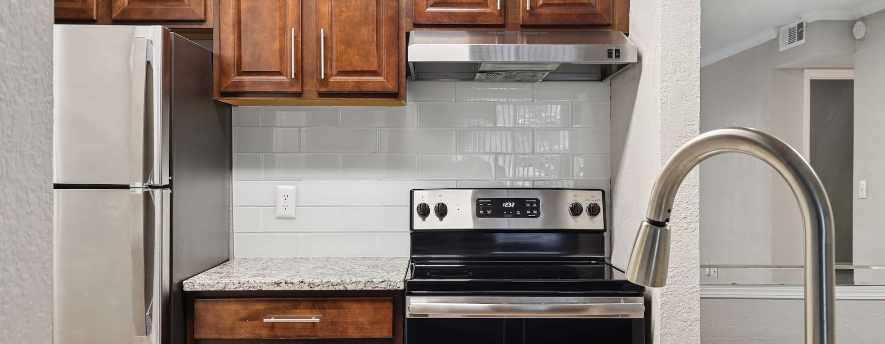 kitchen with wood cabinets and quarts countertops