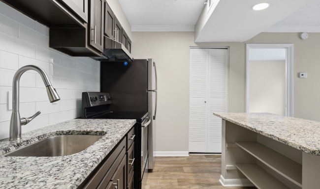 kitchen with wood cabinets and large island