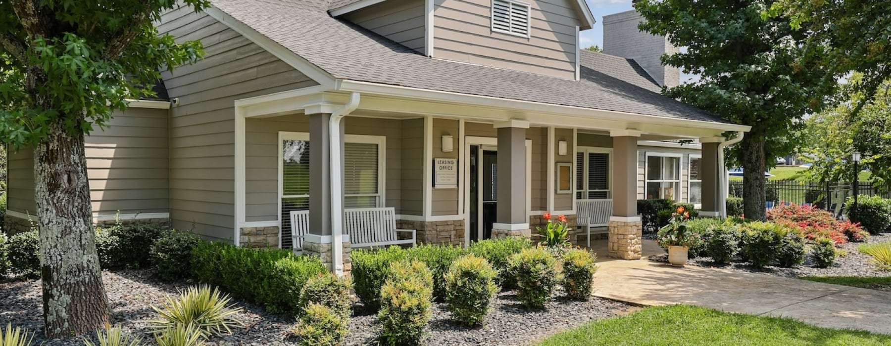 leasing office with shrubs and trees