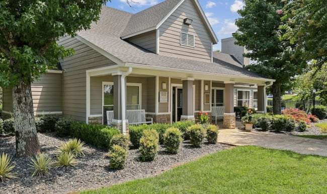 leasing office with shrubs and trees