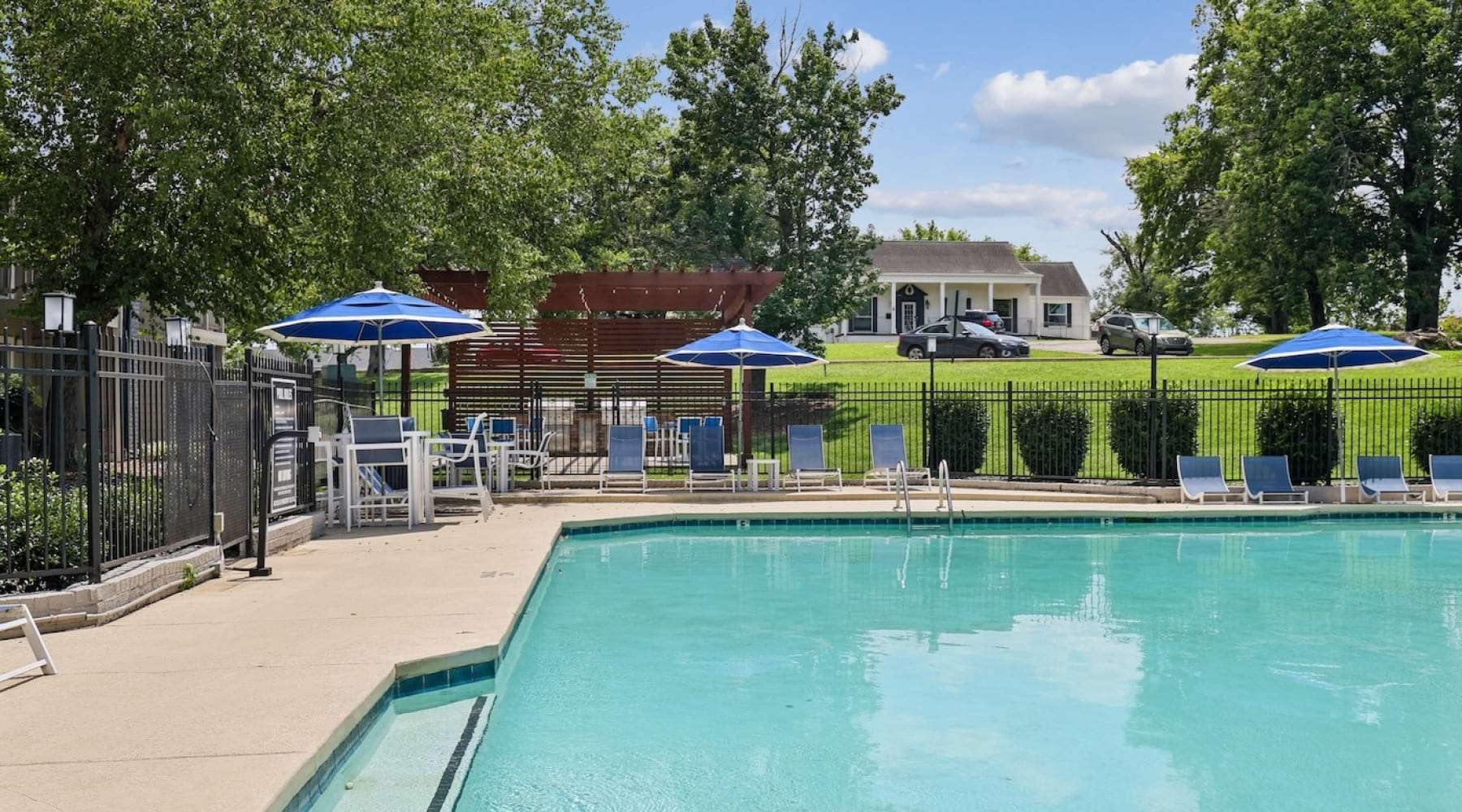 pool with chairs and umbrellas