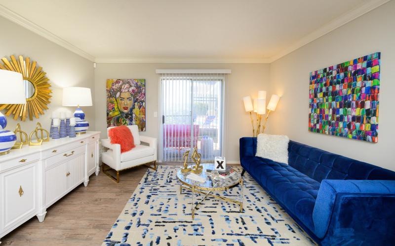 a living room with a blue couch