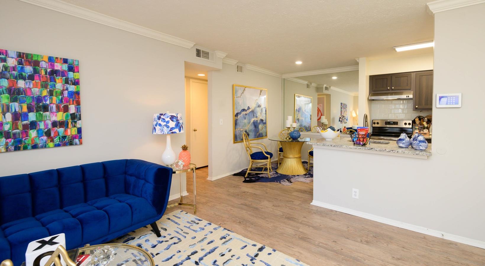 a living room with a blue couch